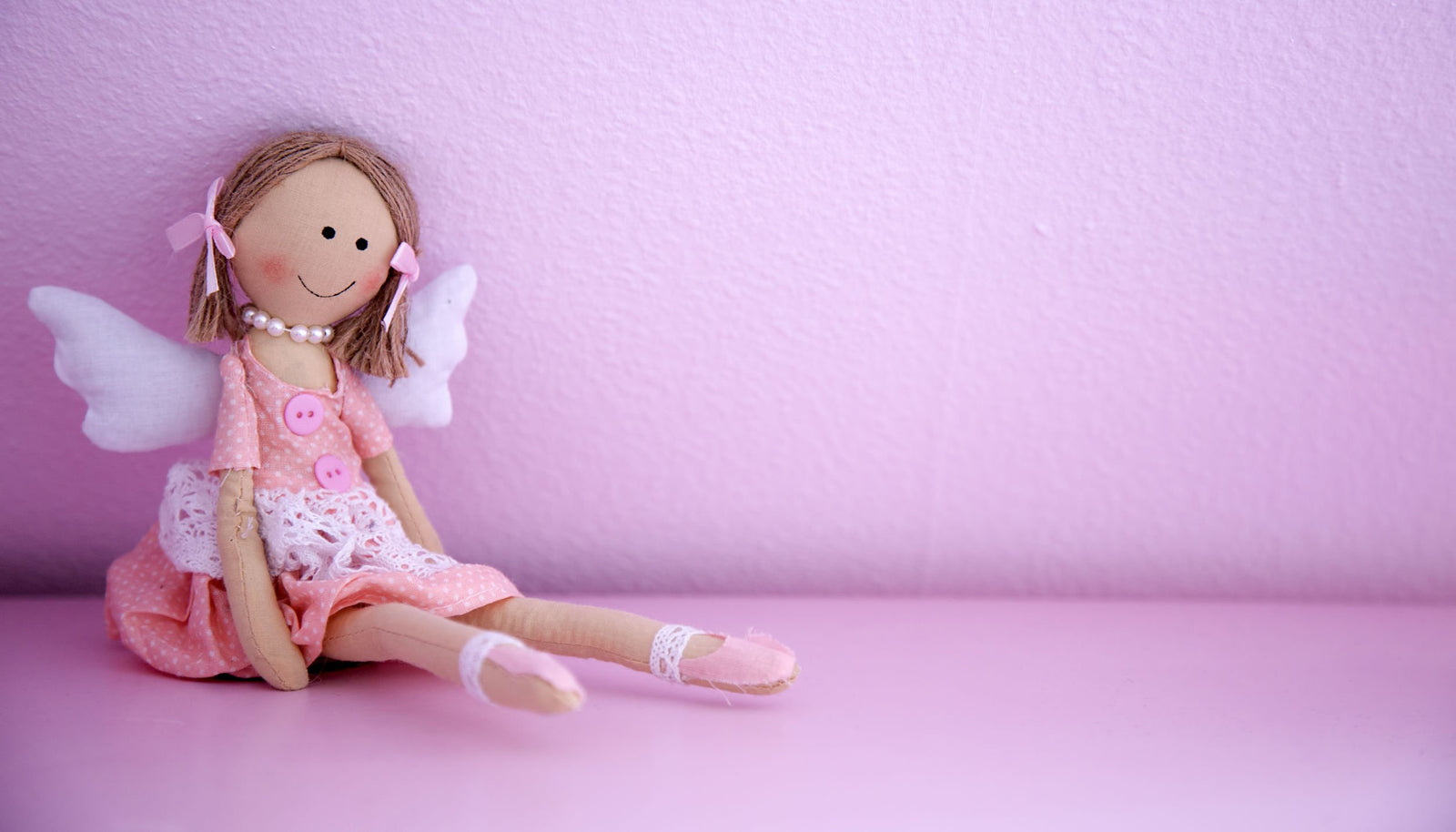 image of stuffed doll as header for girls printed sewing pattern collection
